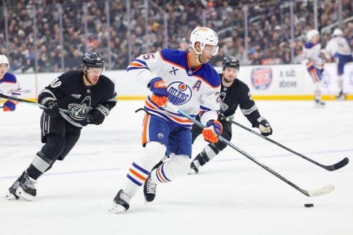FILE - Edmonton Oilers defenseman Darnell Nurse, center front, moves the puck against Los Angeles Kings left wing Artemi Panarin, left, and center Scott Laughton, right, during the first period of an NHL hockey game, April 11, 2026, in Los Angeles. (AP Photo/Ryan Sun, File)