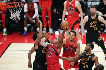 Toronto Raptors' Collin Murray-Boyles (12) drive to the net against the Cleveland Cavaliers during second half NBA playoff basketball action in Toronto on Friday, May 1, 2026. THE CANADIAN PRESS/Nathan Denette