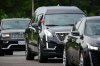 A police escort leads a procession with the body of Toronto Police Const. Marc Pinizzotto, who was killed in the line of duty conducting a raid earlier in the day, at the Chief Coroner's office, in Toronto, on Thursday, June 11, 2026. THE CANADIAN PRESS/Sammy Kogan
