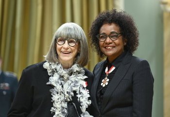 Marilyn Brooks of Toronto is invested as a member of the Order of Canada by former governor general Michaelle Jean on behalf of Gov. Gen. Mary Simon during a ceremony at Rideau Hall in Ottawa, on Thursday, Nov. 17, 2022. Brooks, who popularized a clothing style that was famously worn by rebellious British youths in the 1960s, has died. THE CANADIAN PRESS/Justin Tang