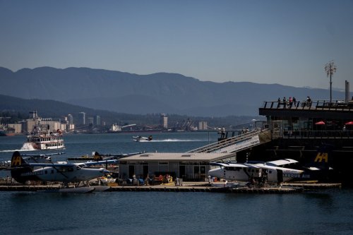 People watch a sea plane take off in Vancouver, B.C., Sunday, July 7, 2024. THE CANADIAN PRESS/Ethan Cairns