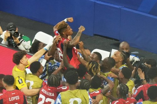 Cape Verde's Helio Varela, top, celebrates scoring his side's second goal against Uruguay during the World Cup Group H soccer match in Miami Gardens, Fla., Sunday, June 21, 2026. (AP Photo/Marta Lavandier)