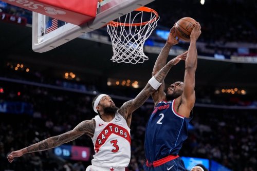 Los Angeles Clippers forward Kawhi Leonard, right, shoots as Toronto Raptors forward Brandon Ingram defends during the first half of an NBA basketball game Wednesday, March 25, 2026, in Inglewood, Calif. (AP Photo/Mark J. Terrill)