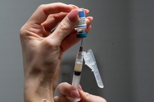 Nurse Lauren Ellenburg prepares a combination measles, mumps and rubella vaccine for a patient at Tiger Pediatrics in Easley, S.C., earlier this year. Muhammad Haaris Tiwana and Julia Smith write that 