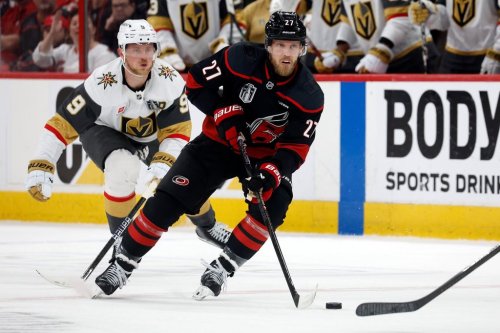 Carolina Hurricanes' Nikolaj Ehlers (27) controls the puck while followed by Vegas Golden Knights' Jack Eichel (9) during the second period in Game 2 of the NHL hockey Stanley Cup Final series in Raleigh, N.C., Thursday, June 4, 2026. (AP Photo/Karl DeBlaker)