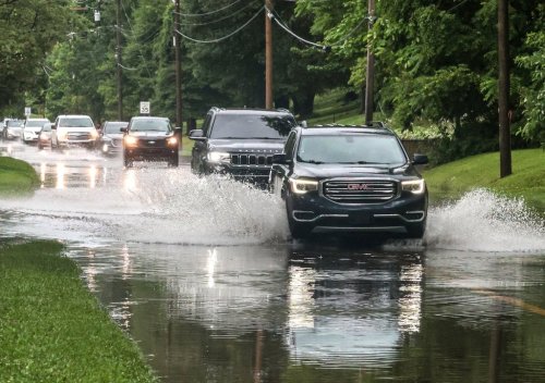 Drivers maneuver their vehicles through high water flooding West Parrish Avenue after a heavy rainfall, Saturday, June 27, 2026, in Owensboro, Ky. (Greg Eans/The Messenger-Inquirer via AP)