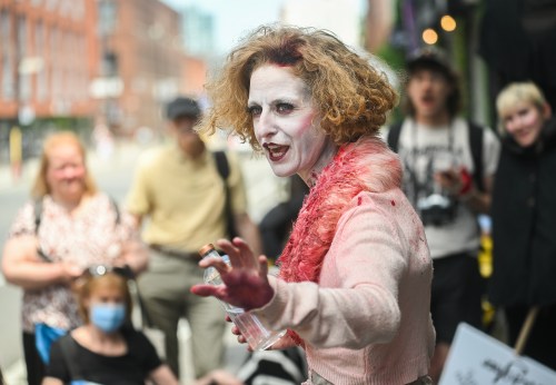 An actress portrays Mary Gallagher during an event to mark her death in Montreal, on Saturday, June 27, 2026. Gallagher was murdered on this day in 1879 and is said to return as a ghost every seven years in the area where she died. THE CANADIAN PRESS/Graham Hughes