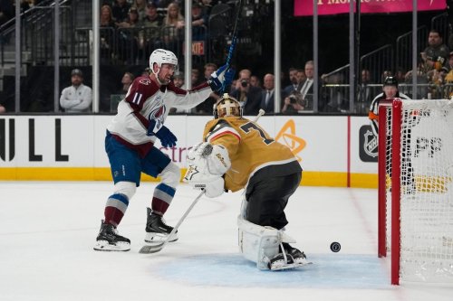 Colorado Avalanche centre Brock Nelson (11) celebrates a goal scored past Vegas Golden Knights goaltender Carter Hart (79) by teammate left wing Gabriel Landeskog (92) during the third period in Game 4 of the Western Conference finals NHL hockey Stanley Cup playoff series Tuesday, May 26, 2026, in Las Vegas. (AP Photo/John Locher)