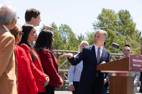 Prime Minister Mark Carney gestures toward B.C. Premier David Eby, while he speaks about housing during an announcement at a construction site in Vancouver on June 18. Deveryn Ross writes that avoidable communications mistakes may eventually come back to haunt the prime minister. (The Canadian Press files)