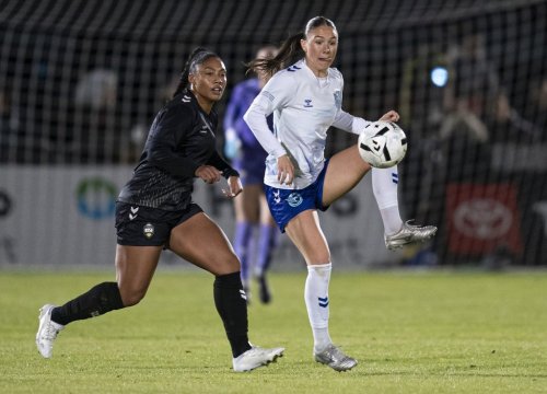 Ottawa Rapid FC's Delaney Baie Pridham (right) receives a pass while pressured by Vancouver Rise's Jessika Cowart during the first half of an NSL semifinal soccer match, in Burnaby, B.C., on Tuesday, Nov. 4, 2025. THE CANADIAN PRESS/Rich Lam