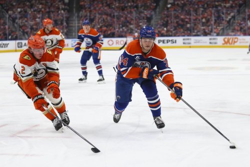 Anaheim Ducks' Jackson LaCombe (2) defends against Edmonton Oilers' Colton Dach (34) during second period first round Game 5 NHL playoff action in Edmonton on Tuesday, April 28, 2026. THE CANADIAN PRESS/Codie McLachlan