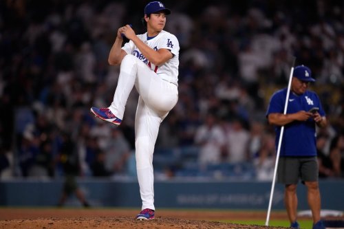 Los Angeles Dodgers' Shohei Ohtani fakes a pitch after the Dodgers defeated the against the Colorado Rockies in a baseball game Wednesday, July 8, 2026, in Los Angeles. (AP Photo/Mark J. Terrill)