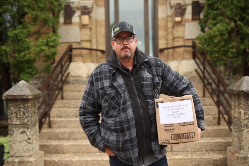 Trevor Bennett, a resident of the RM of Rosedale, holds a box of letters from area residents in opposition to a proposed windmill project on Tuesday. Bennett was on his way to Minnedosa to drop the letters off to MLA for Agassiz Jodie Bryant.
(Tim Smith/The Brandon Sun)