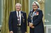 Donald Duguid of Winipeg is invested as a member of the Order of Canada by Gov. Gen. Mary Simon during a ceremony at Rideau Hall in Ottawa, on Thursday, Oct. 20, 2022. Duguid skipped the 1970 and 1971 World Champion curling team, and later became a pioneer in curling telecasting, introducing microphones on curlers. THE CANADIAN PRESS/Justin Tang