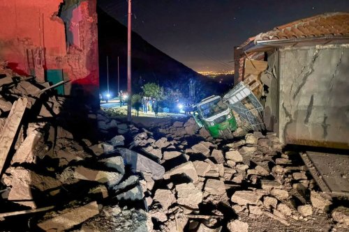 A motor tricycle is stuck amid the debris of homes that collapsed after an earthquake struck Pumpuya, Peru, Sunday, July 19, 2026. ( AP Photo/Jhefry Sedano)