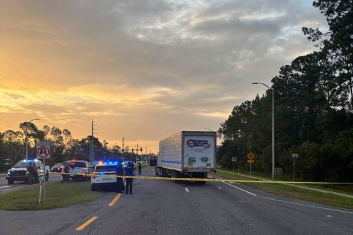 In this photo provided by the St. Johns County Sheriff's Office, the eastbound lanes of SR 16 between Outlet Mall Boulevard and Inman Road in St. Augustine, Fla., are shutdown after a fatal collision. (St. Johns County Sheriff's Office via AP)