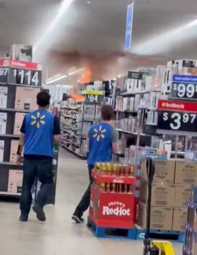 A fire breaks out at the Walmart in St. Vital Centre on Monday. A 47-year-old man is accused of setting the blaze, which caused more than $10 million in damage. (Supplied)