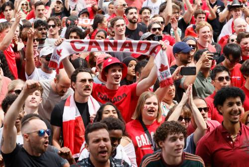 Canadian soccer fans cheer as team Canada takes on Morocco in a FIFA World Cup round of 16 match during a free outdoor watch party in Ottawa on July 4. Canada was ready for the threat of infectious disease at the World Cup, but needs to remain vigilant, Rose Weeks writes. (The Canadian Press files)