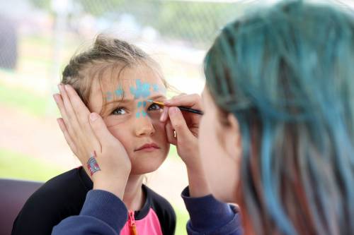 Theo Knight of Hamiota has her face painted by Aubree Drul during the annual Hamiota Fair on Thursday. (Tim Smith/The Brandon Sun)