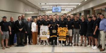 Current and former members of the Brandon Wheat Kings U18 AAA organization pose with MLA Glen Simard, third from left, Keystone Centre CEO and general manager Connie Lawrence, in white, and Mayor Jeff Fawcett, right, at the announcement of the 2027 Telus Cup coming to Brandon in April. The seven-day national championship will include the Wheat Kings as the host club. (Thomas Friesen/The Brandon Sun)