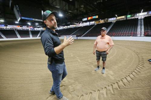 Devin Epp, agricultural sales and event manager for the Keystone Centre (left), standing with footing technician Allan Quast from Lacombe, Alta., explains how the facility readies the arena floor for Canada&rsquo;s National Arabian Championship, which starts next Thursday in Brandon. (Photos by Matt Goerzen/The Brandon Sun)