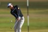 Jeeno Thitikul, of Thailand, chips onto the 14th green during the first round of the Women's British Open golf championship in Lytham St Annes, England, Thursday, July 30, 2026. (AP Photo/Jon Super)