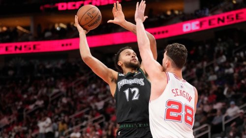 Minnesota Timberwolves forward Kyle Anderson (12) looks to shoot a basket against Houston Rockets center Alperen Sengun (28) during the second half of an NBA basketball game, Friday, April 10, 2026, in Houston. (AP Photo/ Karen Warren)