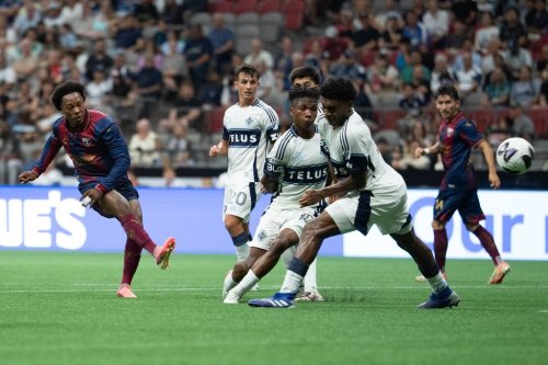 Atlante FC's Jhojan Julio (7) kicks the ball past Vancouver Whitecaps' Ralph Priso-Mbongue (6) to score during the first half of a Leagues Cup soccer match in Vancouver, on Tuesday, Aug. 4, 2026. THE CANADIAN PRESS/Ethan Cairns