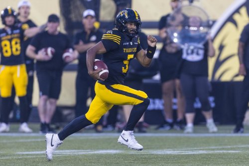 Hamilton Tiger-Cats' Tre Ford carries the ball during first half CFL football action against the Toronto Argonauts, in Hamilton on Saturday, July 18, 2026. THE CANADIAN PRESS/Michael P. Hall