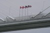 FILE - Canadian and American flags are shown on the Gordie Howe Bridge under construction between Windsor, Ontario and Detroit, May 22, 2026. (AP Photo/Paul Sancya, File)