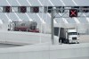 Transports trucks use the Gordie Howe International Bridge in Windsor, Ont., on Monday, July 27, 2026, the first day the crossing was open to vehicles. THE CANADIAN PRESS/Dax Melmer