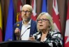 Green Party Leader Elizabeth May speaks as former Green MP Mike Morrice looks on during a news conference on Parliament Hill in Ottawa on Wednesday, June 17, 2026. THE CANADIAN PRESS/Adrian Wyld