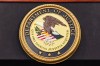 The Department of Justice logo is seen on a podium at the U.S. Attorney's Office on Oct. 23, 2025, in New York. (AP Photo/Angelina Katsanis, File)