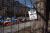 A sign advocating for support for the homeless is seen through a fenced-in homeless encampment in Victoria Park in Halifax on Monday, March 4, 2024. THE CANADIAN PRESS/Darren Calabrese