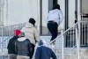 People enter a processing centre at the Canada/US border crossing in Saint-Bernard-de-Lacolle, Que., Thursday, April 10, 2025. THE CANADIAN PRESS/Graham Hughes