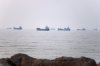 Commercial vessels are seen in the Strait of Hormuz off Bandar Abbas, Iran, Tuesday, June 30, 2026. (Amirhosein Khorgooi/ISNA via AP)