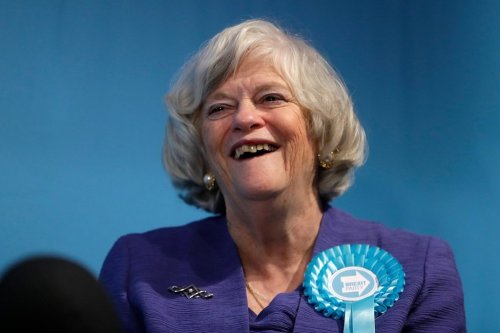 FILE -Ann Widdecombe, Brexit Party member, is interviewed after Nigel Farage, Leader of Britain's Brexit Party, spoke on stage at the launch of their policies for the General Election campaign, in London, Nov. 22, 2019. (AP Photo/Kirsty Wigglesworth, File)