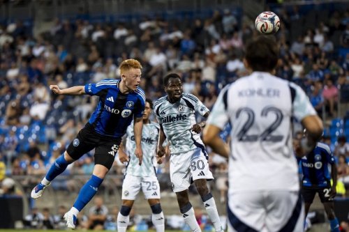 CF Montreal's Matty Longstaff (8) takes a header against the New England Revolution during first half MLS action in Montreal on Saturday, Aug. 1, 2026. THE CANADIAN PRESS/Christopher Katsarov