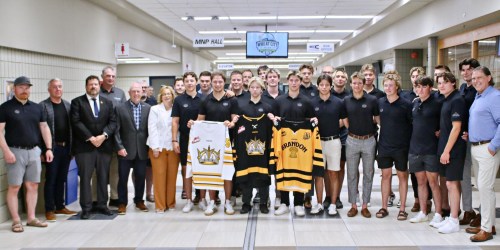 Current and former members of the Brandon Wheat Kings U18 AAA organization pose with MLA Glen Simard, third from left, Keystone Centre CEO and general manager Connie Lawrence, in white, and Mayor Jeff Fawcett, right, at the announcement of the 2027 Telus Cup coming to Brandon in April. The seven-day national championship will include the Wheat Kings as the host club. (Thomas Friesen/The Brandon Sun files)