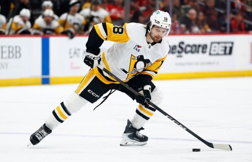 FILE - Pittsburgh Penguins center Tommy Novak skates with the puck during the first period of an NHL hockey game against the New Jersey Devils, April 9, 2026, in Newark, N.J. (AP Photo/Noah K. Murray, File)