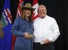 Alberta Premier Danielle Smith, left, and Ontario Premier Doug Ford swap belt buckles after announcing the Northern Shield pipeline proposal in Calgary, Monday, July 6, 2026. THE CANADIAN PRESS/Jeff McIntosh