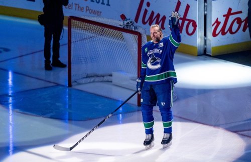Former Vancouver Canucks player Alexander Edler enters the ice for a ceremonial face off before an NHL hockey game between the Vancouver Canucks and the Philadelphia Flyers in Vancouver, on Friday, October 11, 2024. THE CANADIAN PRESS/Ethan Cairns