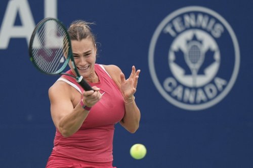 Aryna Sabalenka of Belarus hits a return to Amanda Anisimova of the United States at the National Bank Open on Aug. 10, 2024, in Toronto. THE CANADIAN PRESS/Chris Young