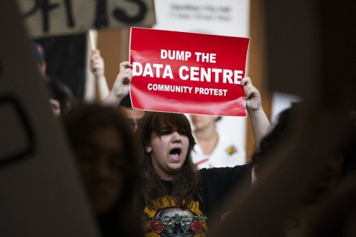 People opposed to AI data centres demonstrate outside council chambers at city hall in Hamilton, Ont., on Wednesday, July 15, 2026. THE CANADIAN PRESS/Nick Iwanyshyn