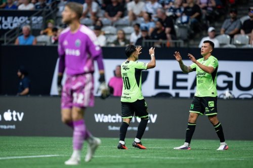Juarez FC's Ettson Ayon (right) celebrates his goal with Ian Torres (10) as Vancouver Whitecaps goalkeeper Isaac Boehmer (32) walks away during the first half of a Leagues Cup soccer match in Vancouver, on Friday, Aug. 7, 2026. THE CANADIAN PRESS/Ethan Cairns