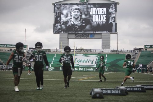 A tribute to Saskatchewan Roughriders player Jayden Dalke is shown on a video display during the Roughriders practice at Mosaic Stadium in Regina on Monday, July 20, 2026. THE CANADIAN PRESS/Kayle Neis