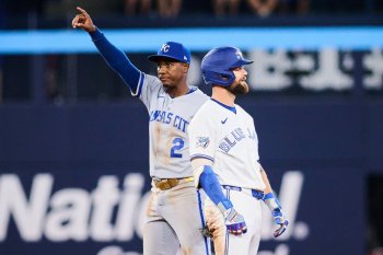 Kansas City Royals second baseman Tyler Tolbert (2) celebrates his team's win as Blue Jays right-fielder Nathan Lukes is called out at second base to end the game in MLB action in Toronto on Aug. 25, 2026. THE CANADIAN PRESS/Sammy Kogan