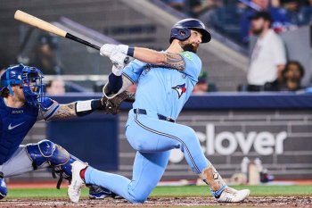 Blue Jays outfielder Nathan Lukes (38) hits a three-run home run against the Kansas City Royals during the fourth inning of a Major League Baseball game in Toronto on Aug. 26, 2026. THE CANADIAN PRESS/Sammy Kogan