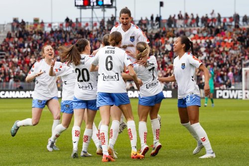 Montreal Roses FC forward Tanya Boychuk (12) is surrounded by her teammates as they celebrate her scoring a goal against AFC Toronto during first half Northern Super League soccer action in Toronto on Saturday, April 19, 2025. THE CANADIAN PRESS/Arlyn McAdorey