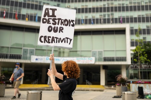 Educators and technology experts say the rapid pace that artificial intelligence is developing and the federal government's aim to make the technology available for all Canadians requires the creation of a framework so grade-level students don't fall behind. People in opposition to AI data centres demonstrate outside city hall in Hamilton, Wednesday, July 15, 2026. THE CANADIAN PRESS/Nick Iwanyshyn